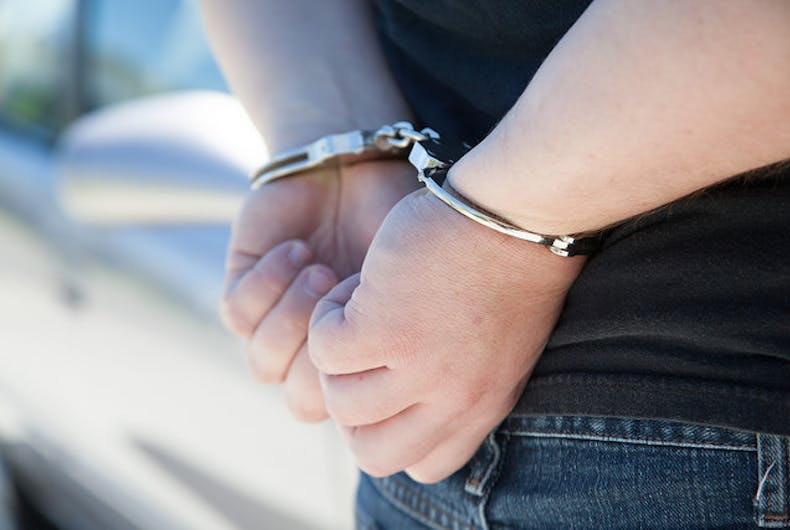 man handcuffed arrested