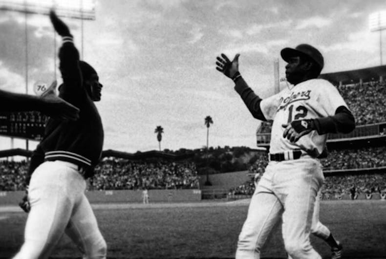 burke.glenn_.dodgers.high_.five_.022218 Meet America’s first openly gay professional baseball player