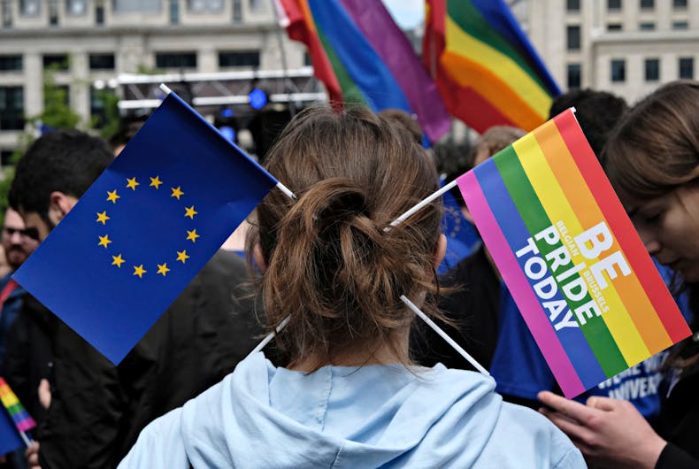 Participant has Rainbow and European flag in his hair during the Belgian Gay Pride parade in Brussels Belgium on May 20, 2017