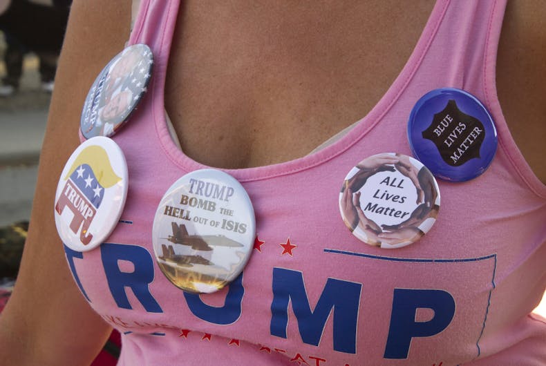 Trump-voter-woman September 12, 2016: Close up of a woman wearing a bright pink Donald Trump T-Shirt covered with Trump campaign buttons on September 12, 2016 in Asheville, NC