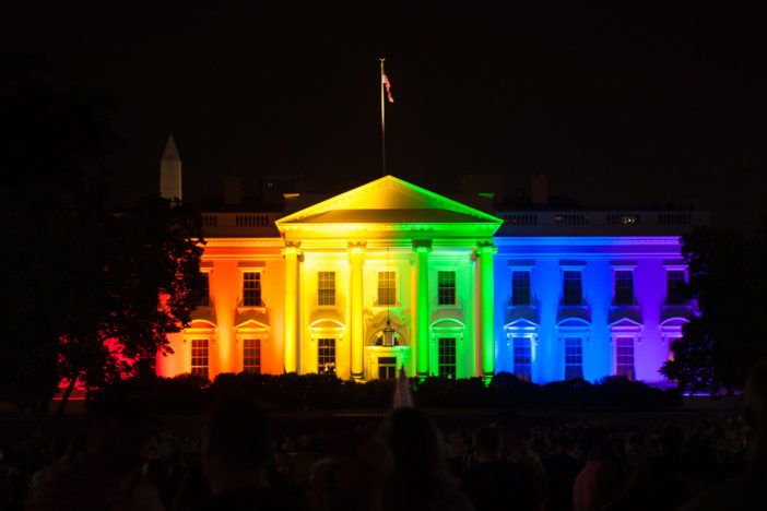 Obama and biden carry gay pride flags around white house