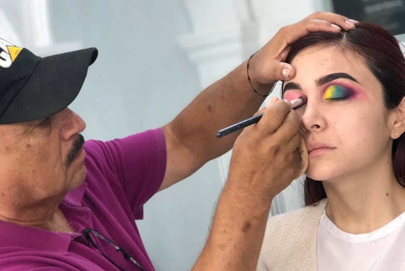 Raúl-Santiago Raúl Santiago applies eye shadow to a model during class