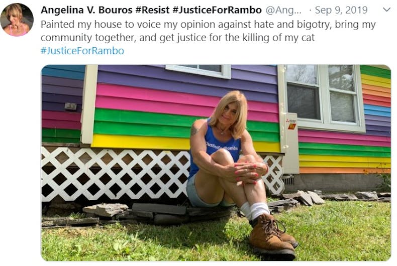 Angelina Bouros in front of her rainbow house in a tweet