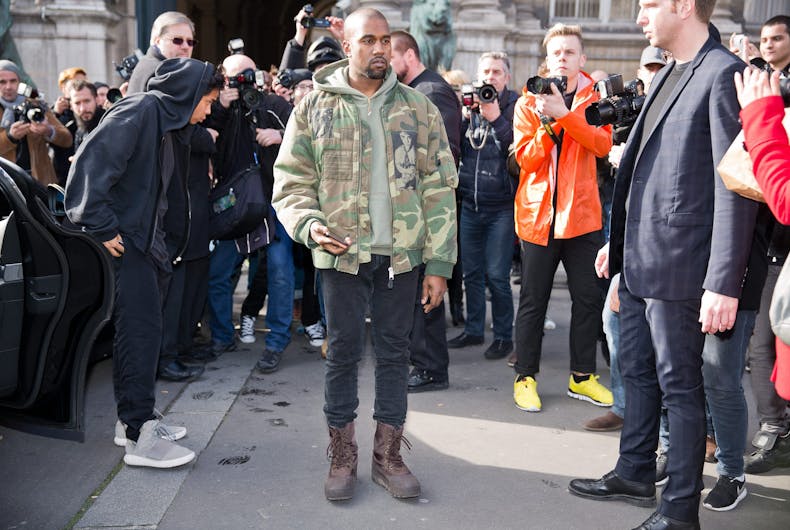 kanye-camo PARIS-MARCH 4, 2015. Kanye West posing for photographers in front of the Dries van Noten fashion show.